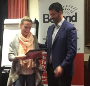 Kelly Swain receiving her NLP Practitioner certificate