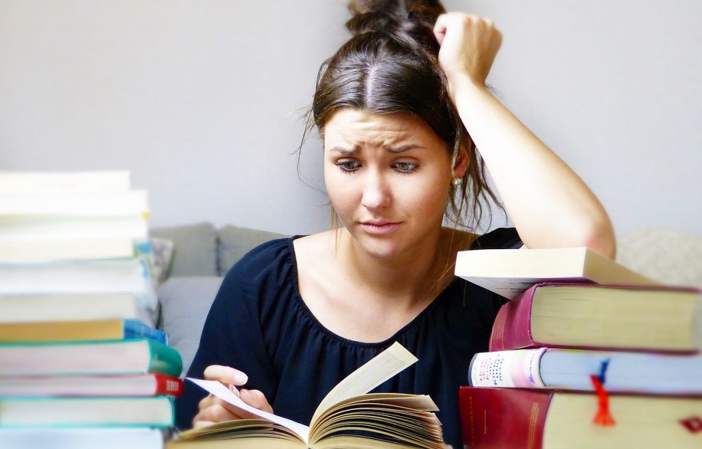 Stressed teenager studying for exams