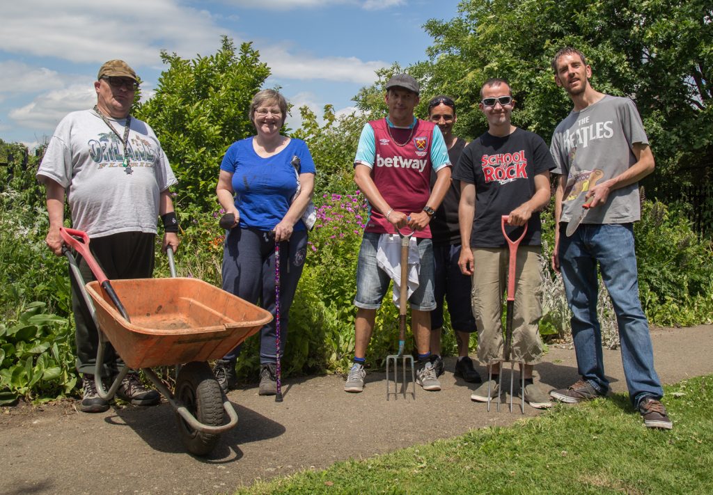 volunteers digging at Trust Links