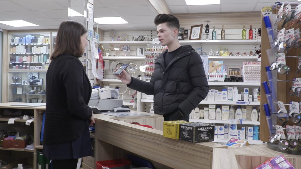 man using EC-Card app in a pharmacy