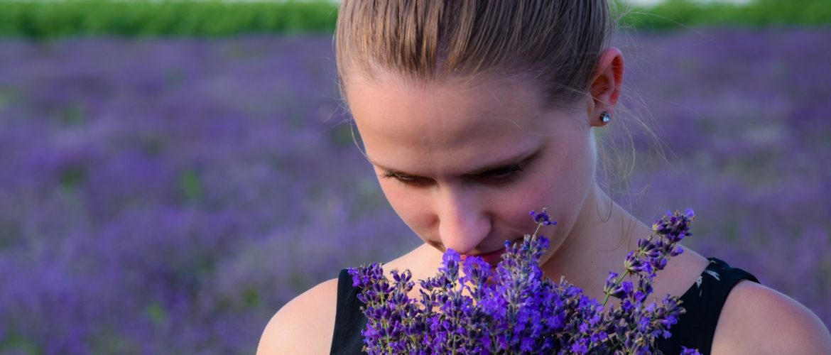 What it’s like to live without a sense of smell? woman smelling lavendar bouqet