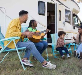 Young family enjoying a planet-friendly campervan holiday